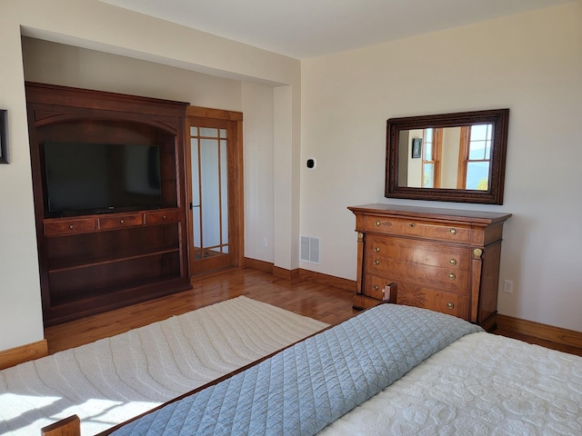 bedroom featuring light hardwood / wood-style flooring