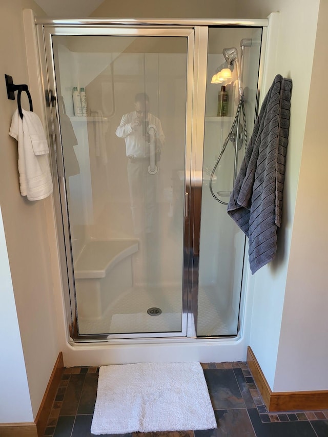 bathroom featuring tile patterned floors and an enclosed shower