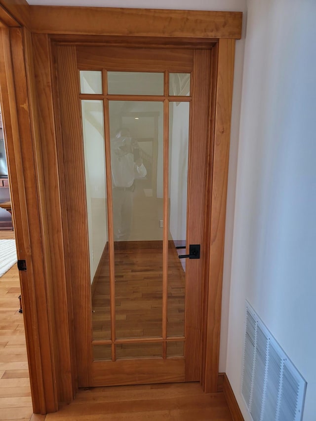 hall featuring hardwood / wood-style flooring