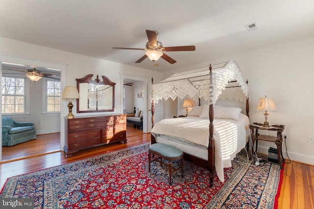 bedroom featuring hardwood / wood-style flooring and ceiling fan