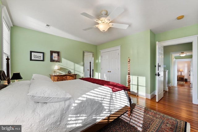 bedroom featuring wood-type flooring and ceiling fan