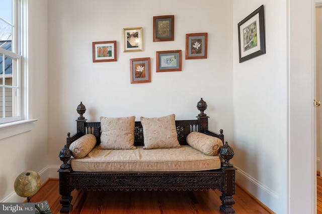 living area with hardwood / wood-style flooring