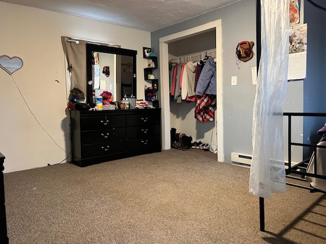bedroom with a closet, carpet flooring, and a textured ceiling