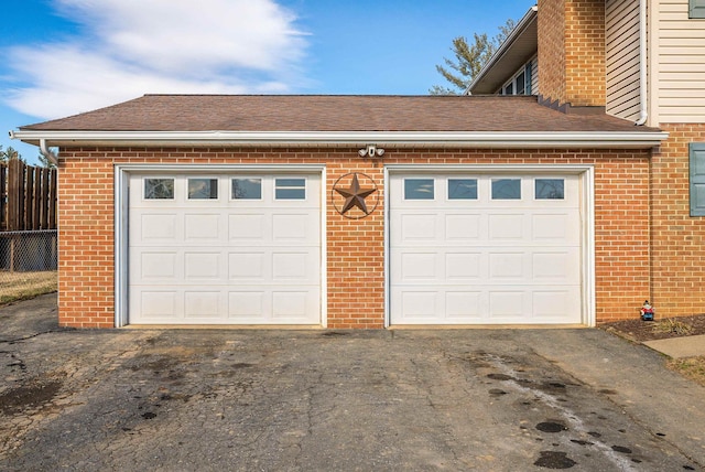 garage with aphalt driveway