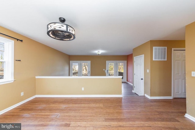 empty room with wood-type flooring