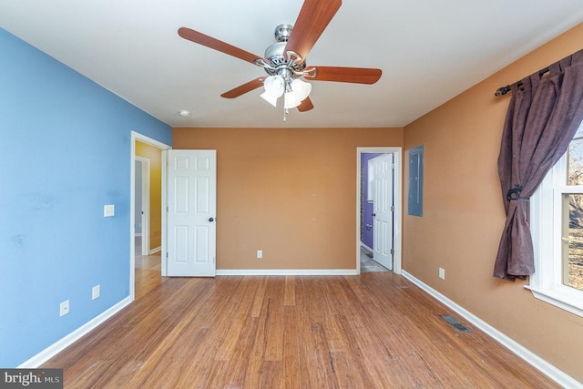 unfurnished bedroom featuring ceiling fan and light hardwood / wood-style flooring