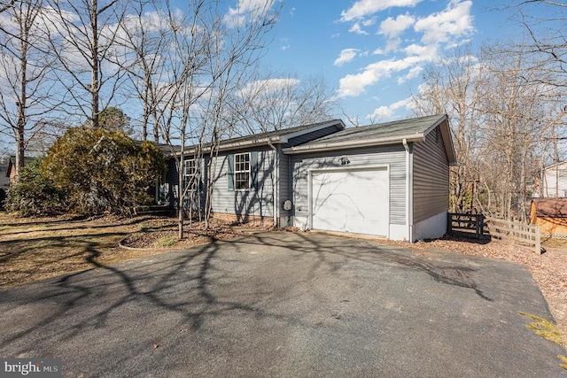 ranch-style home with a garage