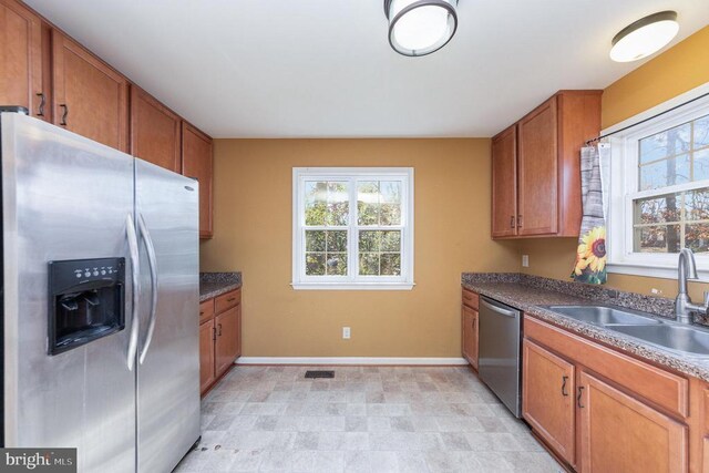 kitchen featuring stainless steel appliances and sink