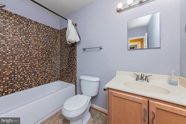 full bathroom featuring vanity, tile patterned flooring, tiled shower / bath combo, and toilet