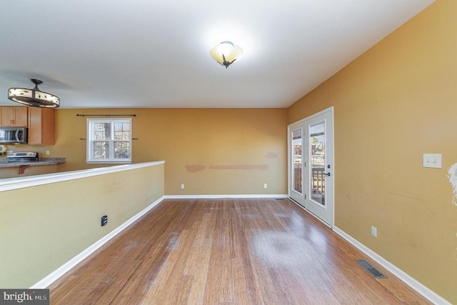 interior space featuring french doors and light wood-type flooring