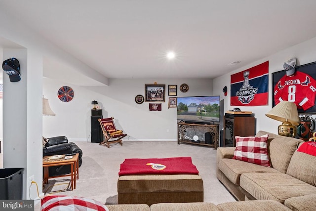 living room featuring carpet flooring and baseboards