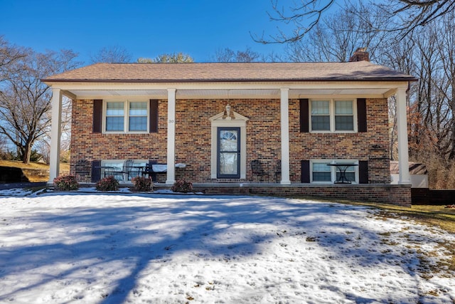 raised ranch featuring a porch