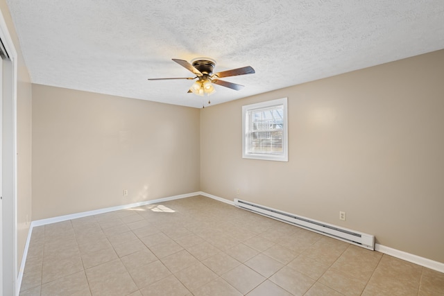 spare room featuring light tile patterned flooring, ceiling fan, a baseboard heating unit, and a textured ceiling