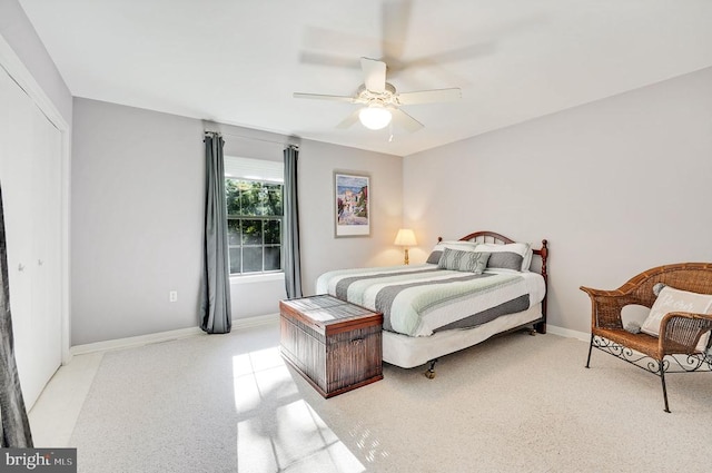 bedroom featuring baseboards and ceiling fan