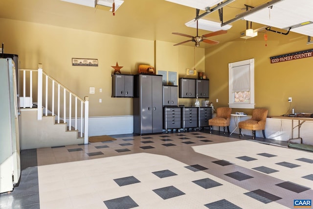 interior space with ceiling fan and white refrigerator