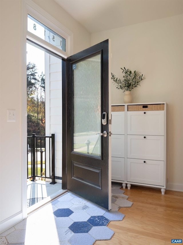 doorway to outside with light hardwood / wood-style flooring