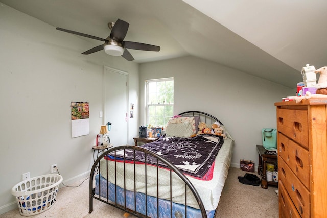 carpeted bedroom featuring vaulted ceiling and ceiling fan