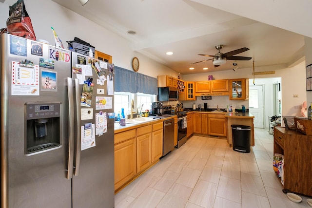 kitchen with ceiling fan, stainless steel appliances, and sink