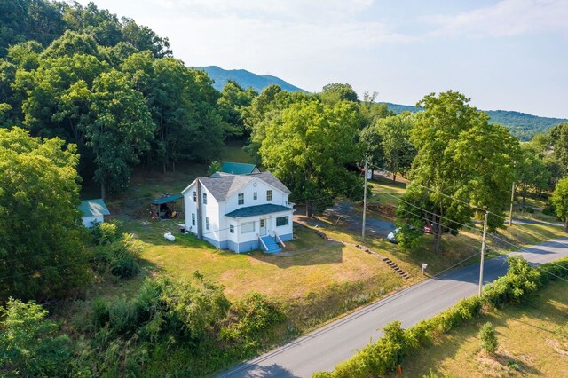 birds eye view of property featuring a mountain view