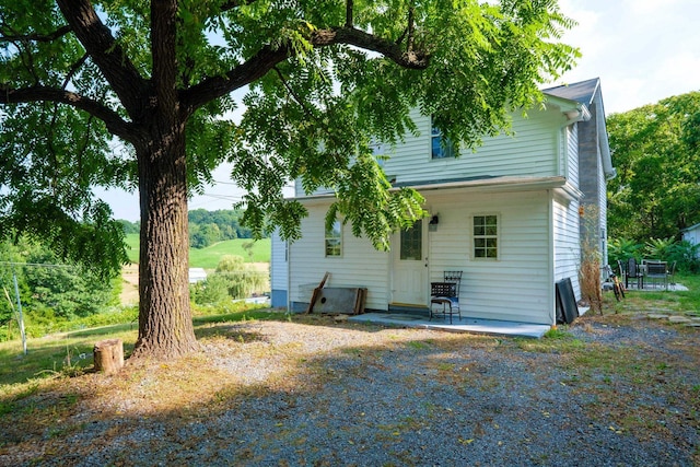 rear view of house with a patio