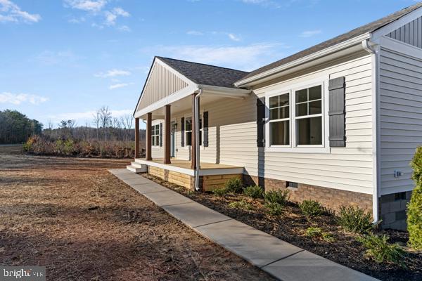 view of home's exterior with covered porch