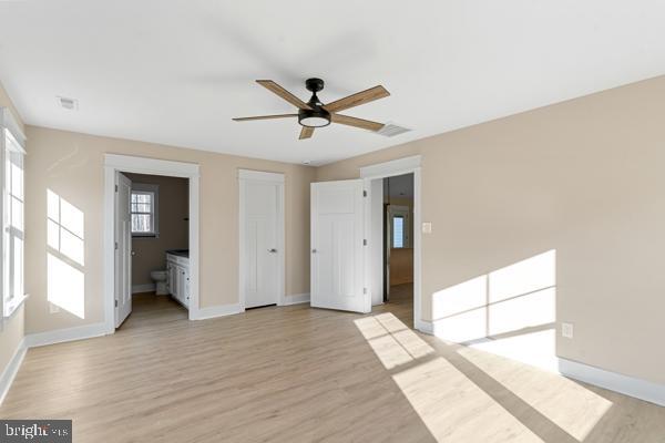 unfurnished bedroom featuring ceiling fan and light hardwood / wood-style flooring