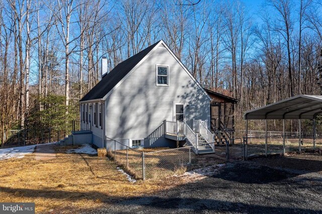 view of home's exterior with a carport