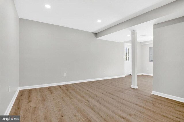 basement featuring light wood-type flooring