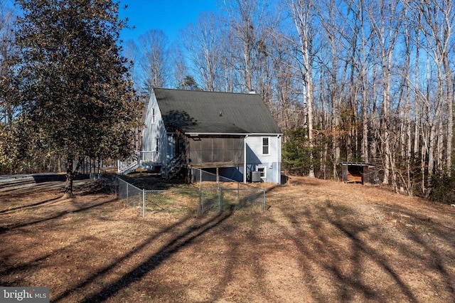 back of property with an outbuilding