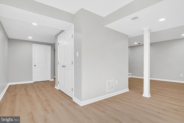 basement featuring light wood-type flooring