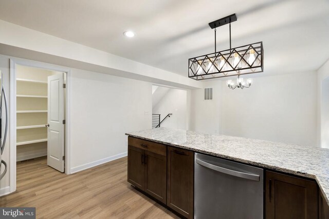 kitchen featuring light wood-type flooring, stainless steel dishwasher, dark brown cabinetry, and decorative light fixtures