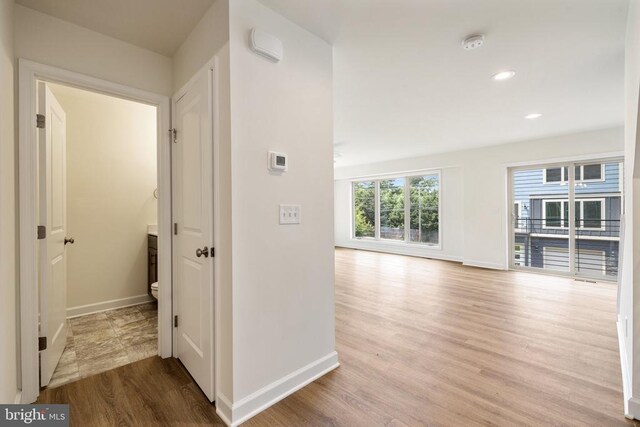 hall with light hardwood / wood-style floors