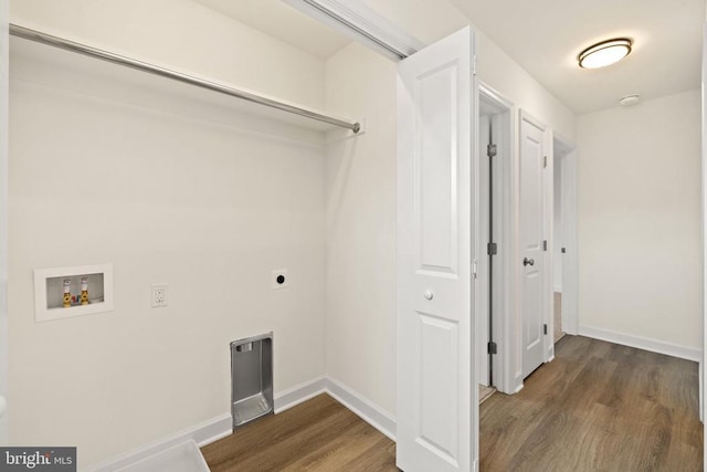 washroom with dark wood-type flooring, washer hookup, and electric dryer hookup