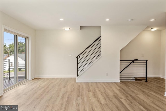 spare room with light hardwood / wood-style flooring