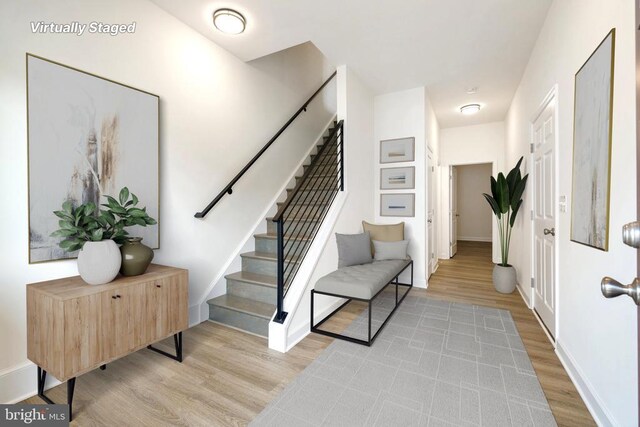 entryway with light hardwood / wood-style floors