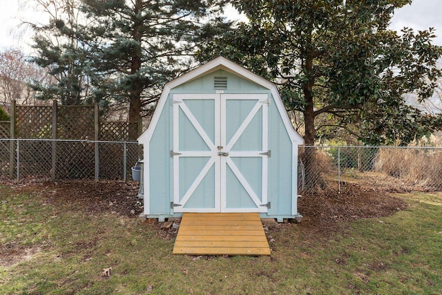 view of outbuilding featuring a lawn