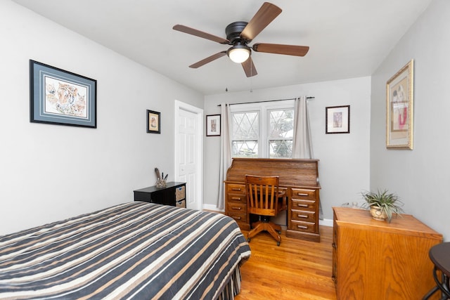 bedroom with ceiling fan and light hardwood / wood-style flooring