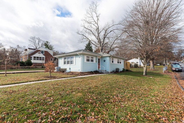 single story home featuring a front lawn