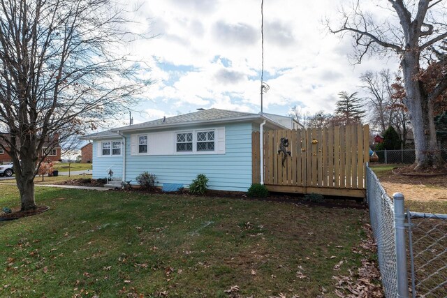 exterior space with a front lawn