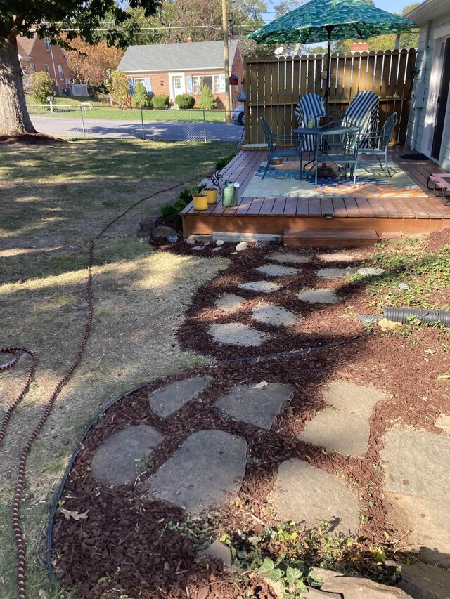 view of yard with a wooden deck