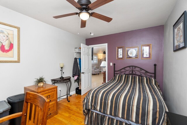 bedroom featuring ceiling fan and light hardwood / wood-style flooring