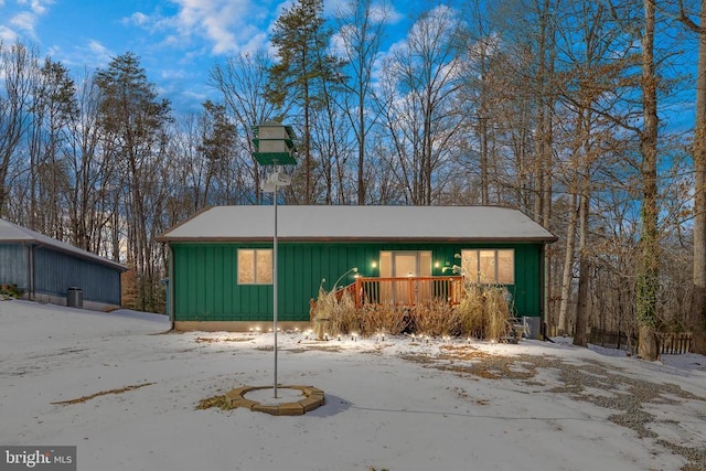 single story home with a wooden deck