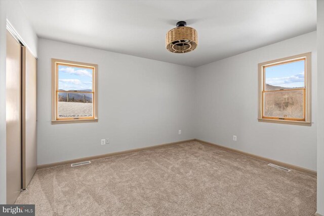 view of carpeted spare room