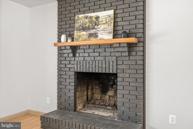 room details featuring hardwood / wood-style flooring and a fireplace