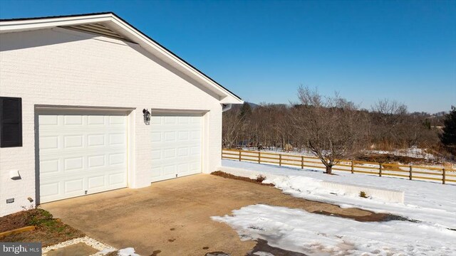 view of snow covered garage