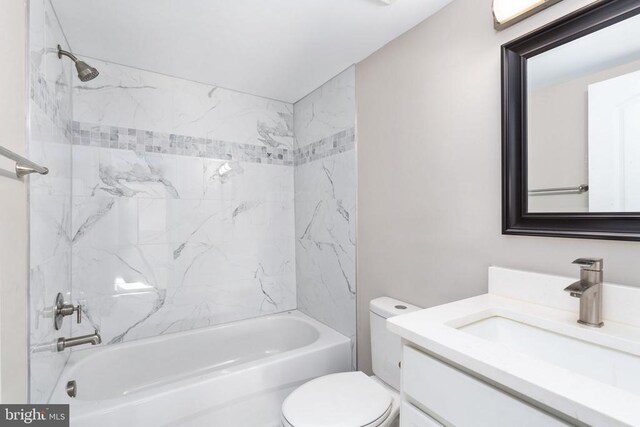 full bathroom with vanity, toilet, and tiled shower / bath combo