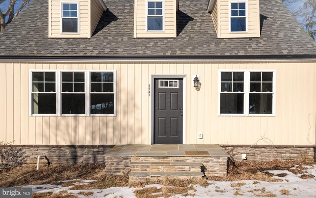 view of snow covered property entrance