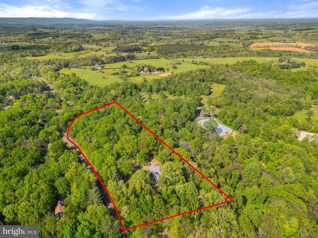drone / aerial view with a view of trees