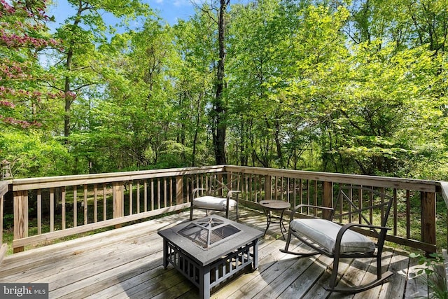 deck with an outdoor fire pit