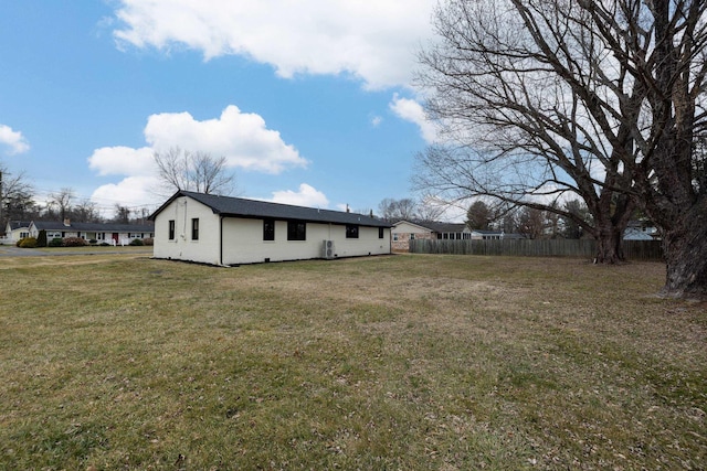 view of property exterior with a yard